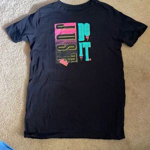 Nike Just Do It. Runs small. Nike size Large. Fits more like a medium like new